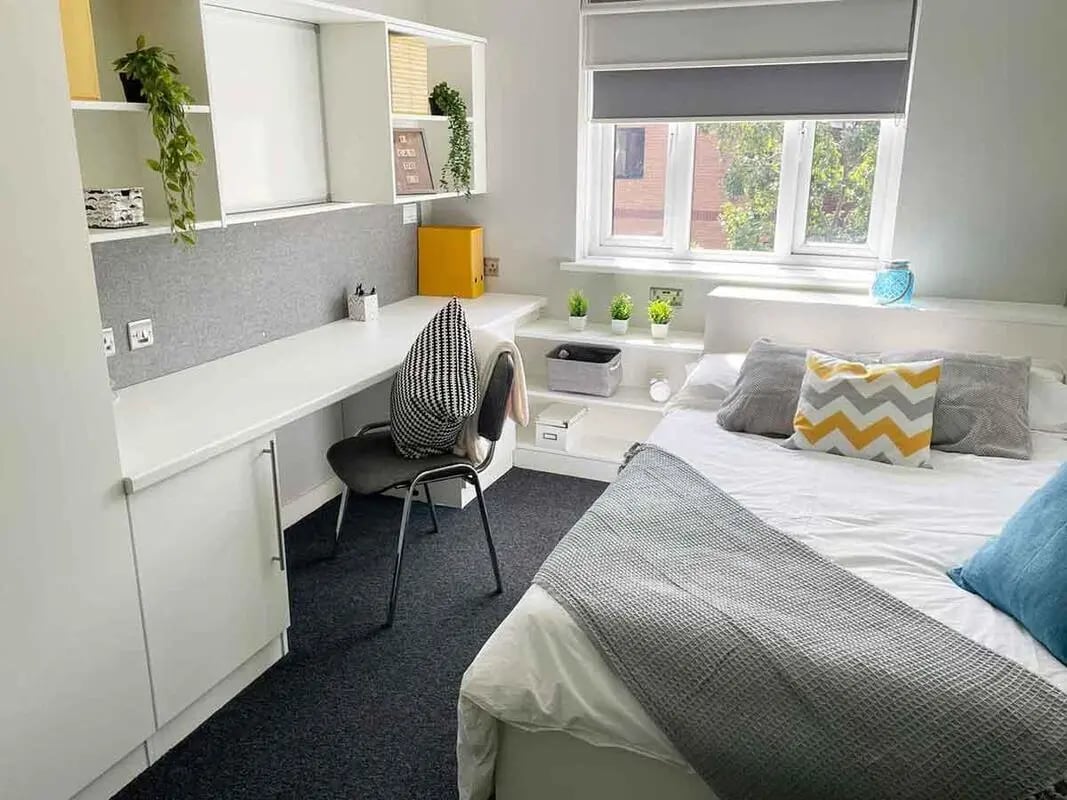 Bed desk and shelves student bedroom at Singer Hall in Coventry Student Accommodation