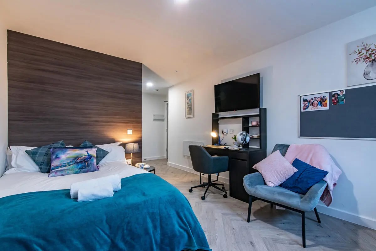 Bed desk chair television and blackboard bedroom at Broadgate House Student Living in Nottingham Student Accommodation