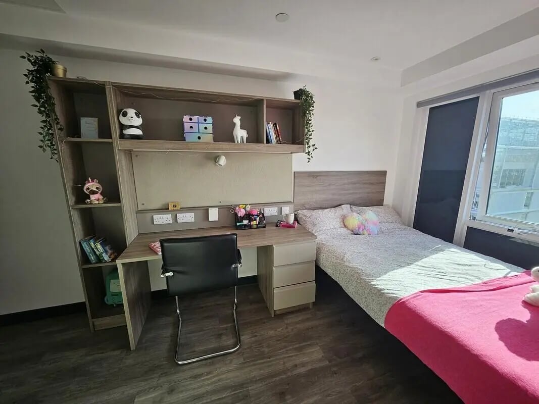 Desk bed shelving with decorations bedroom study area at Coppergate Swansea in Swansea Student Accommodation