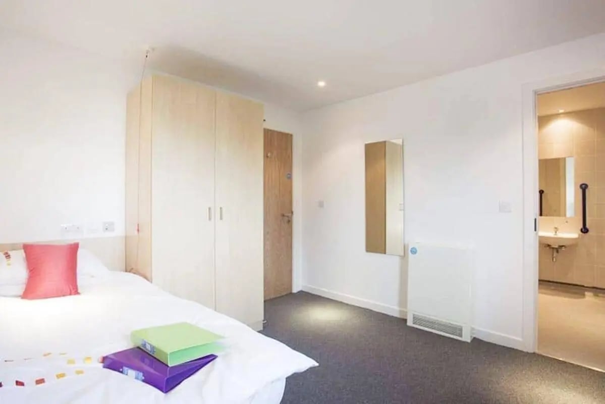 Bed wardrobe binders mirror and heater bedroom at Edinburgh College Residences in Edinburgh Student Accommodation