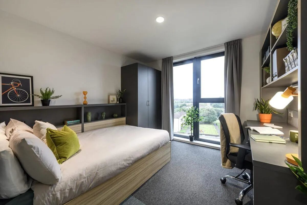 Bed desk wardrobe with window and view bedroom at St James Glasgow in Glasgow Student Accommodation