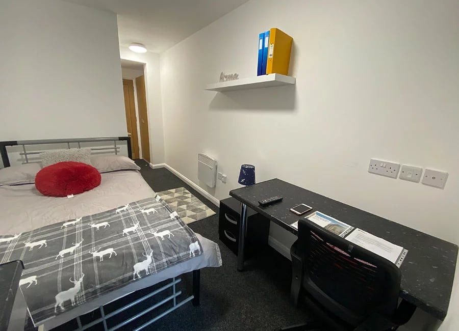 Bed desk chair and rug bedroom at Regent Road in Leicester Student Accommodation