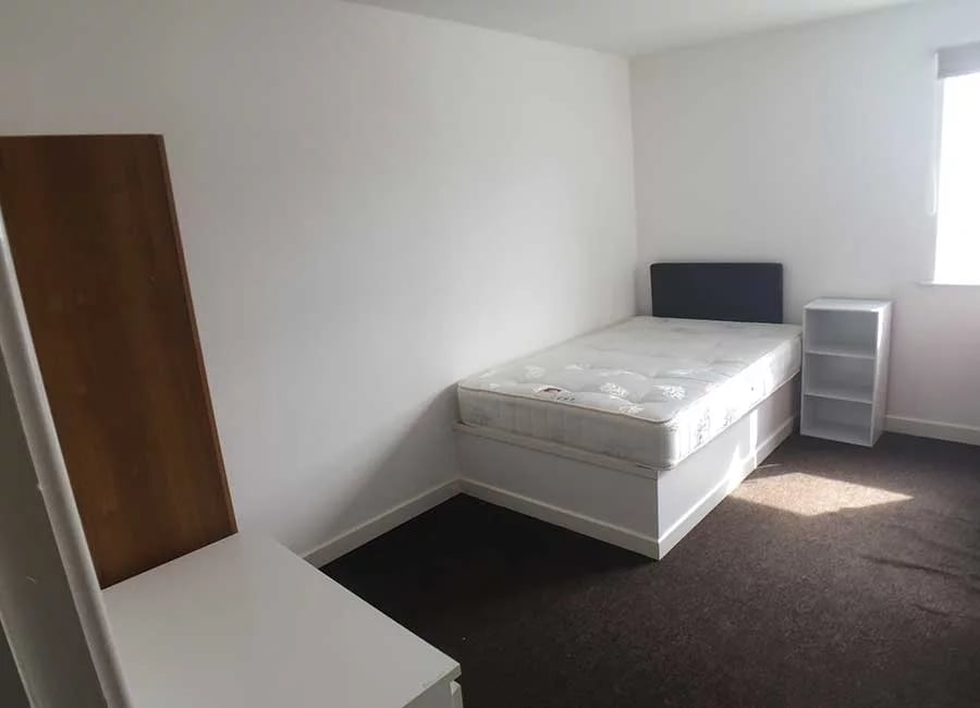 Bed desk and shelving unit bedroom at The Student Block in Loughborough Student Accommodation