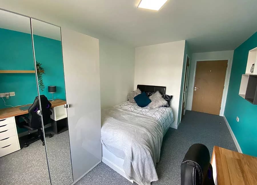 Bed desk chair mirrored wardrobe bedroom at The Student Block in Loughborough Student Accommodation