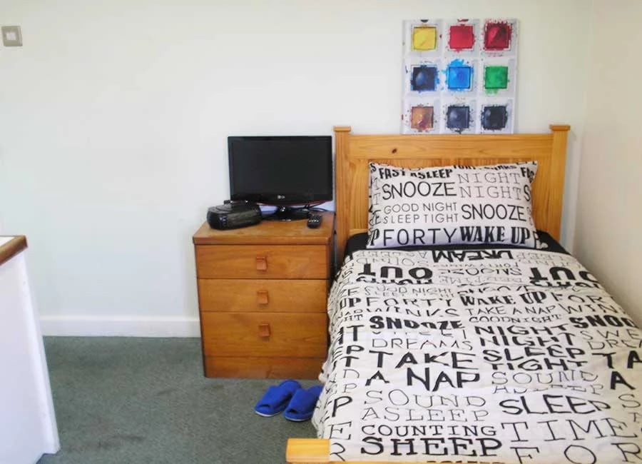 Bed dresser television slippers painting bedroom at Kingfisher Halls in Loughborough Student Accommodation