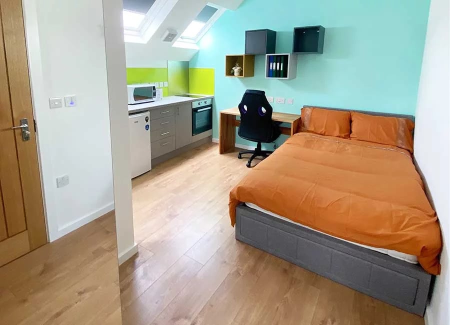 Bed desk kitchen and microwave studio apartment at Kingfisher Halls in Loughborough Student Accommodation