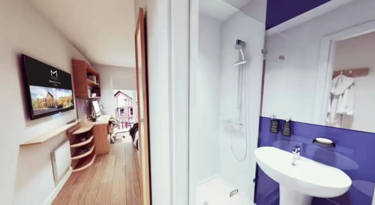 Desk TV shelves shower and sink bathroom at Albany Student Village in Coventry Student Accommodation