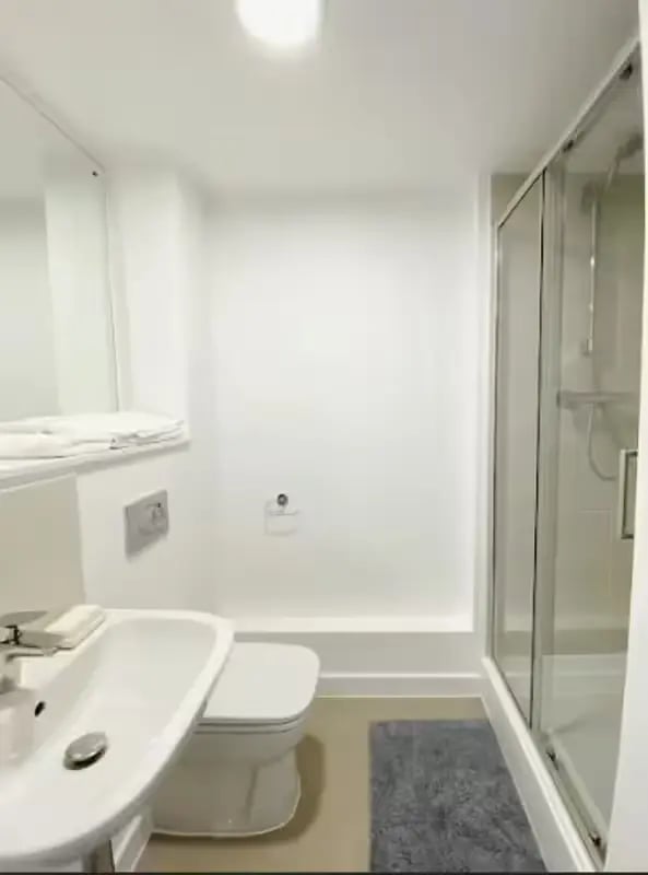 Sink toilet shower with glass door bathroom at Abbey House in Coventry Student Accommodation