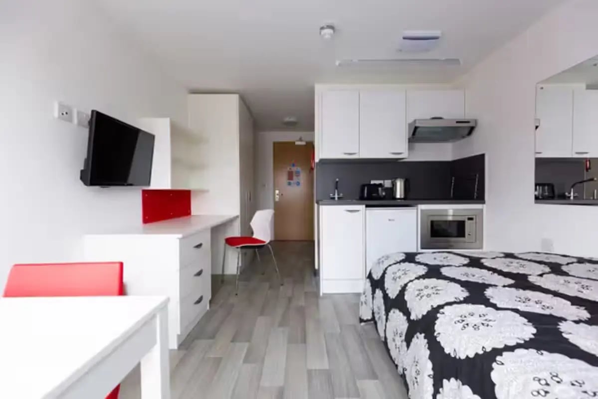 Bed desk kitchen microwave television studio at Julian Court in Coventry Student Accommodation