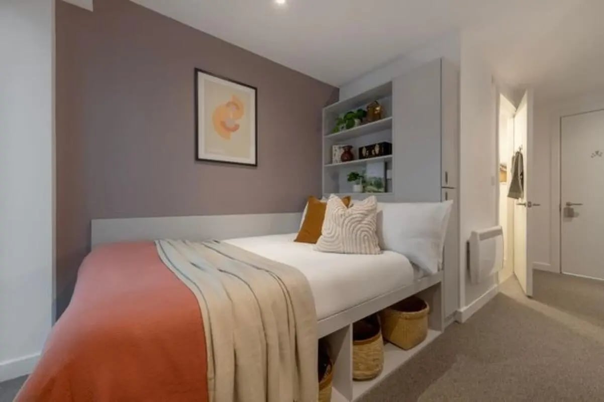 Bed with storage pillows and artwork Bedroom at Infinity Coventry in Coventry Student Accommodation