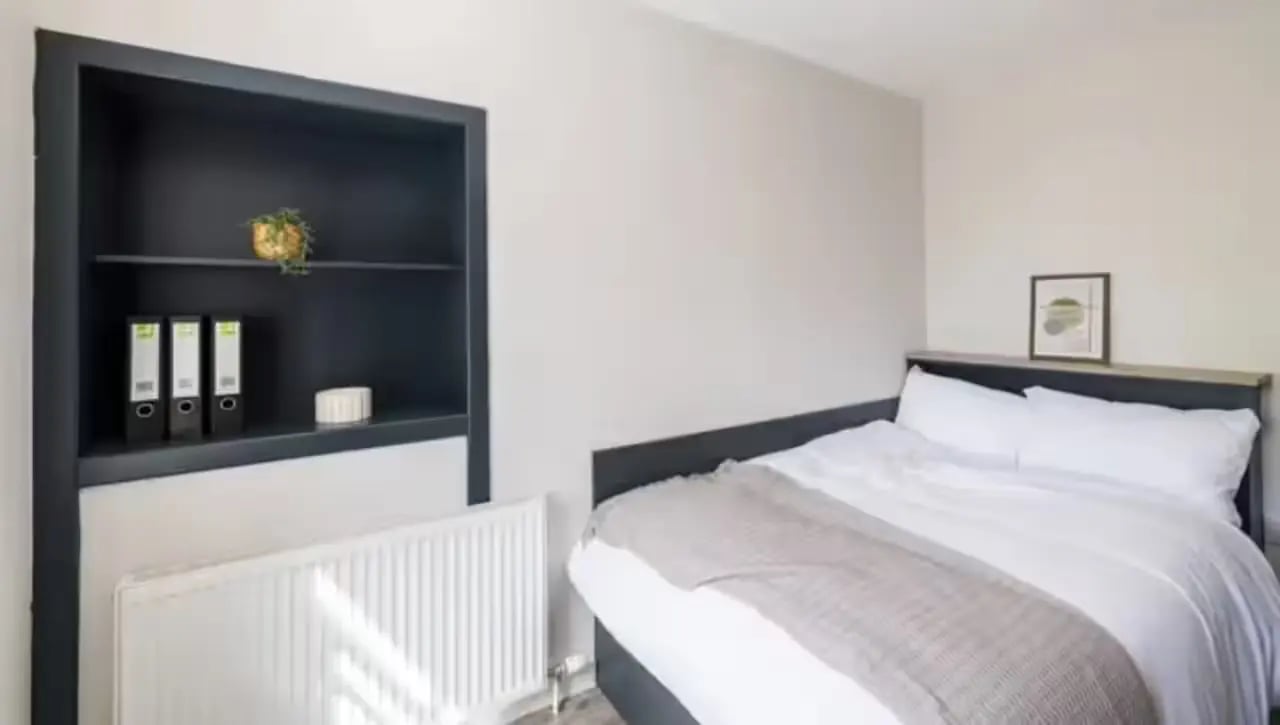 Bed with white linens and a grey blanket bedroom at Lyon Street Terrace in Dundee Student Accommodation