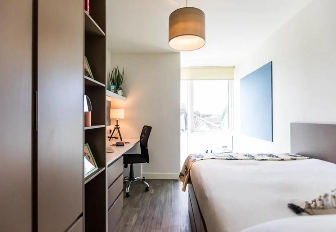 Desk chair shelf and bed student bedroom at Aparto Arbury Court in Kingston Upon Thames Student Accommodation
