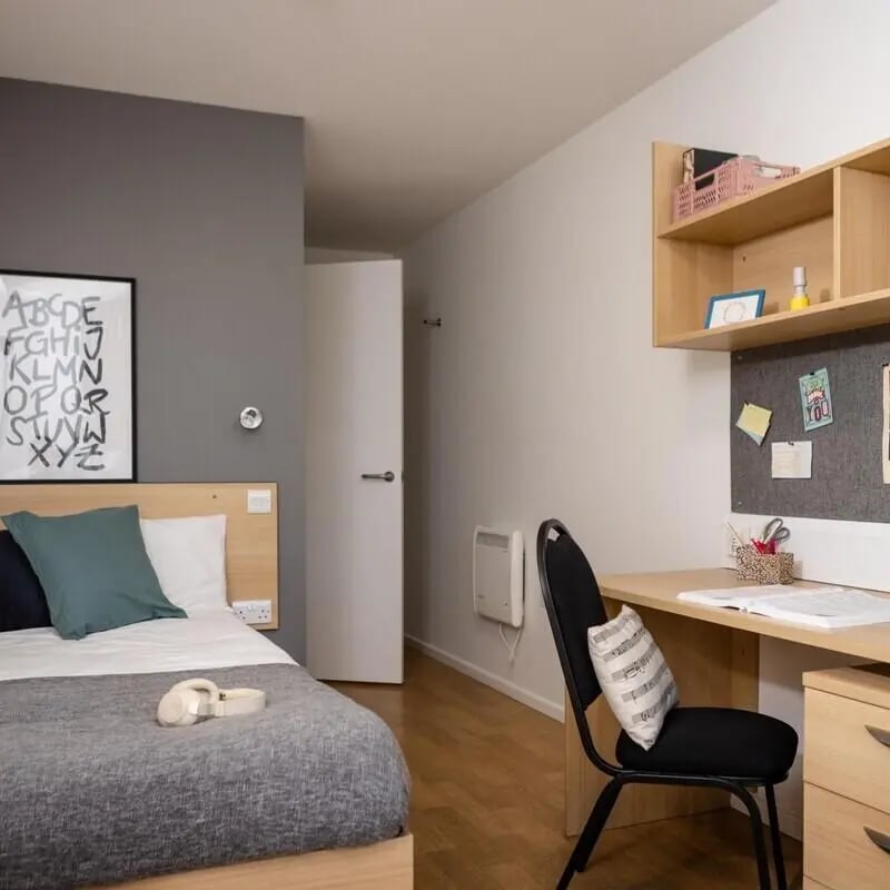 Bed desk and chair student accommodation bedroom at Prince Consort Village in London Student Accommodation