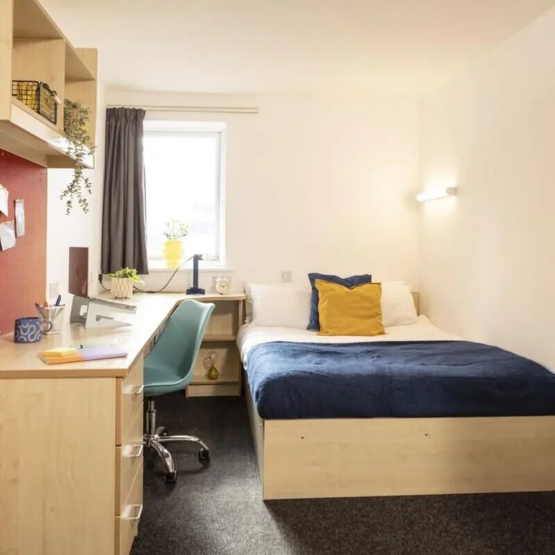 Bed desk chair window and shelves bedroom at Albert Court in Liverpool Student Accommodation