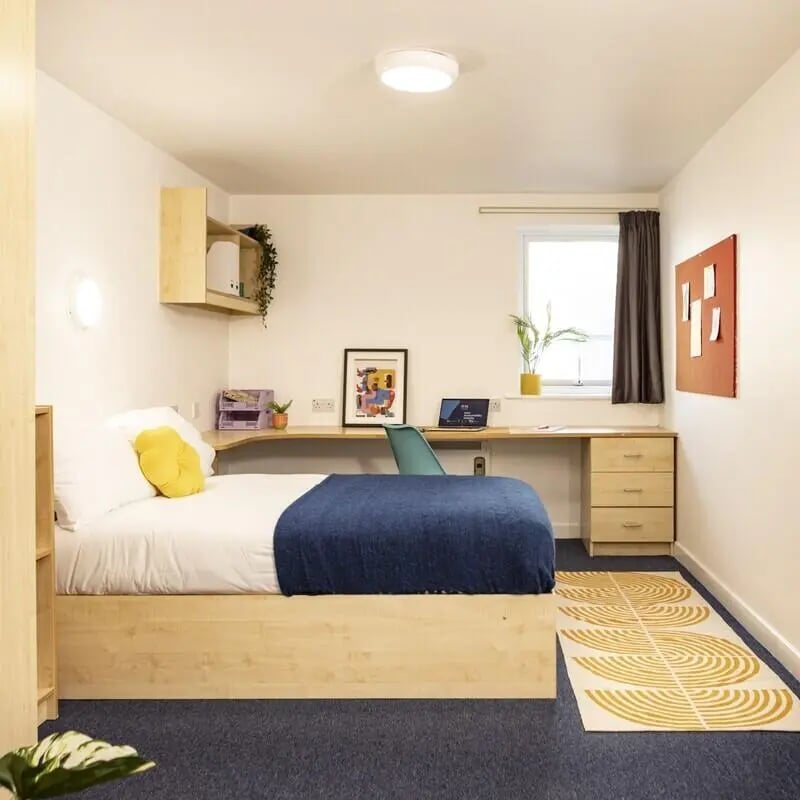 Bed desk shelf and bulletin board bedroom at Albert Court in Liverpool Student Accommodation