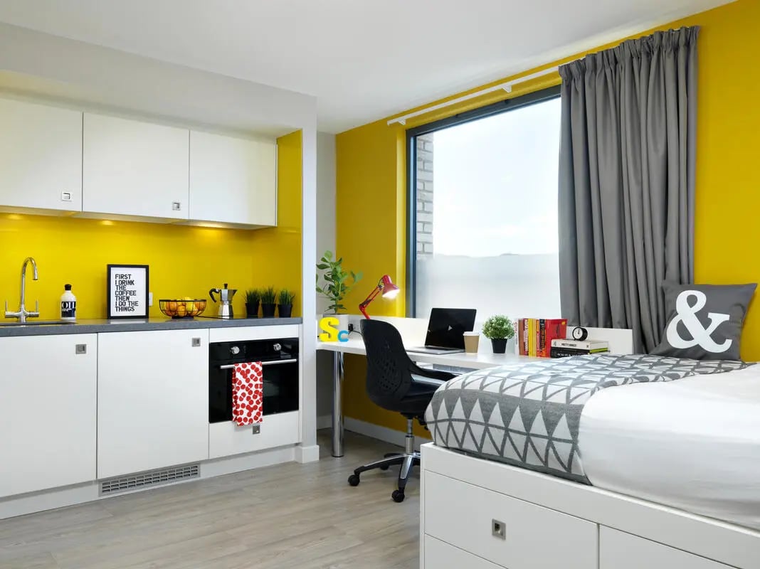 Kitchen study area and bed in studio apartment at Student Castle Edinburgh in Edinburgh Student Accommodation