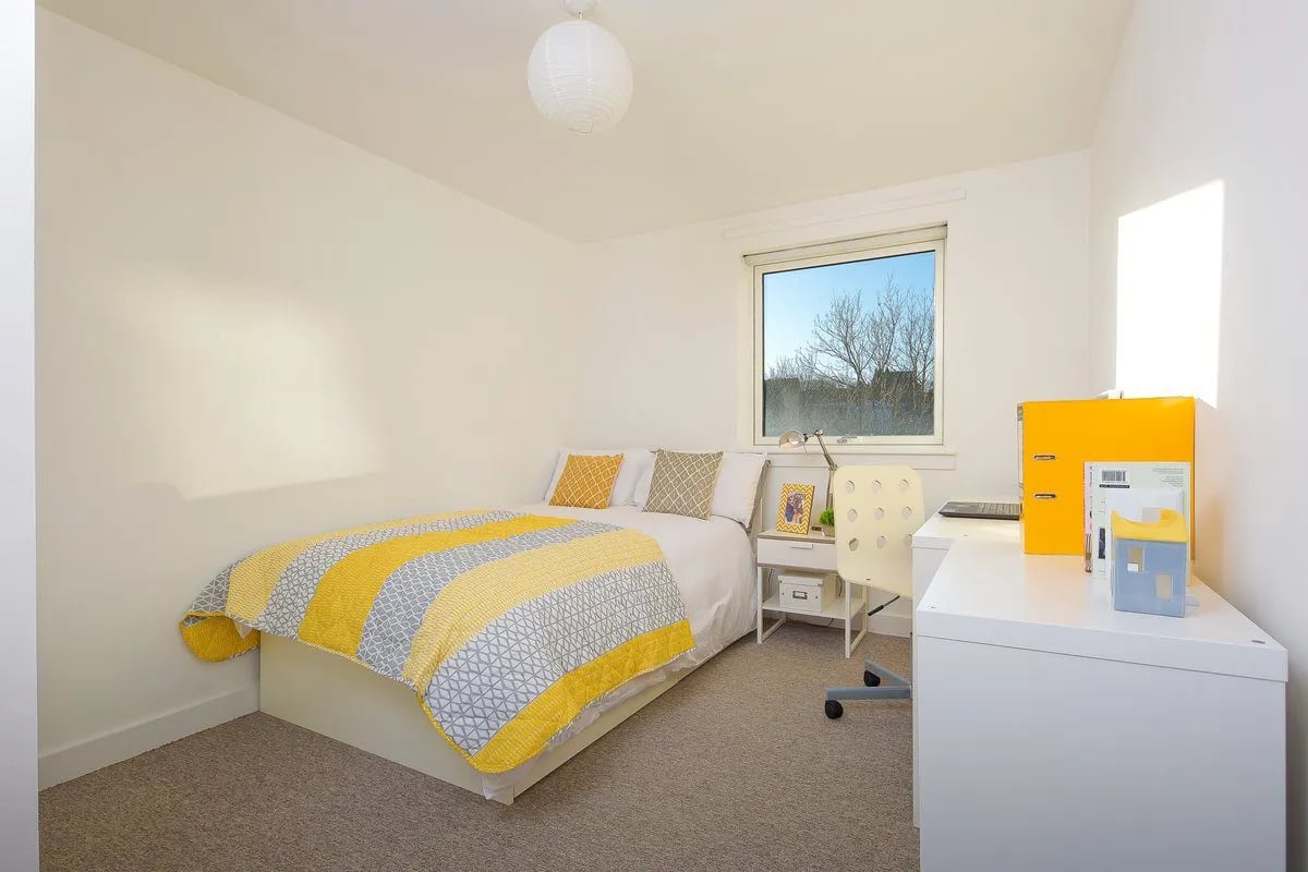 Bed desk chair window and bedding bedroom at King Street 403 in Aberdeen Student Accommodation