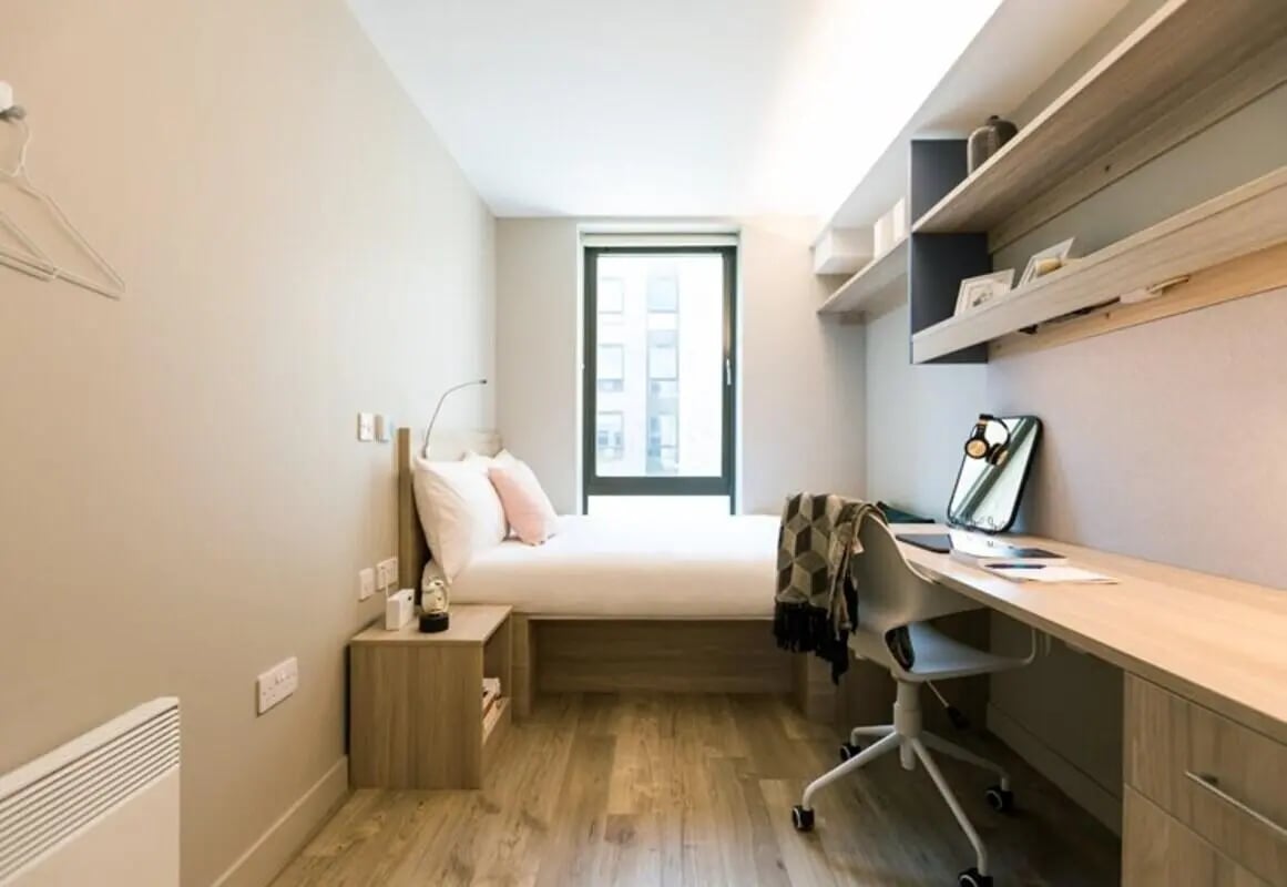 Bed desk chair and shelving student bedroom at Caton Court in Lancaster Student Accommodation
