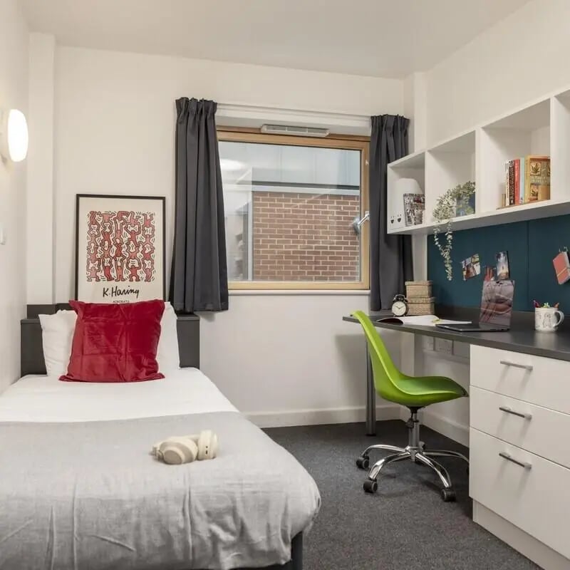 Bed desk and shelving student bedroom interior at Fitzroy Court in Luton Student Accommodation