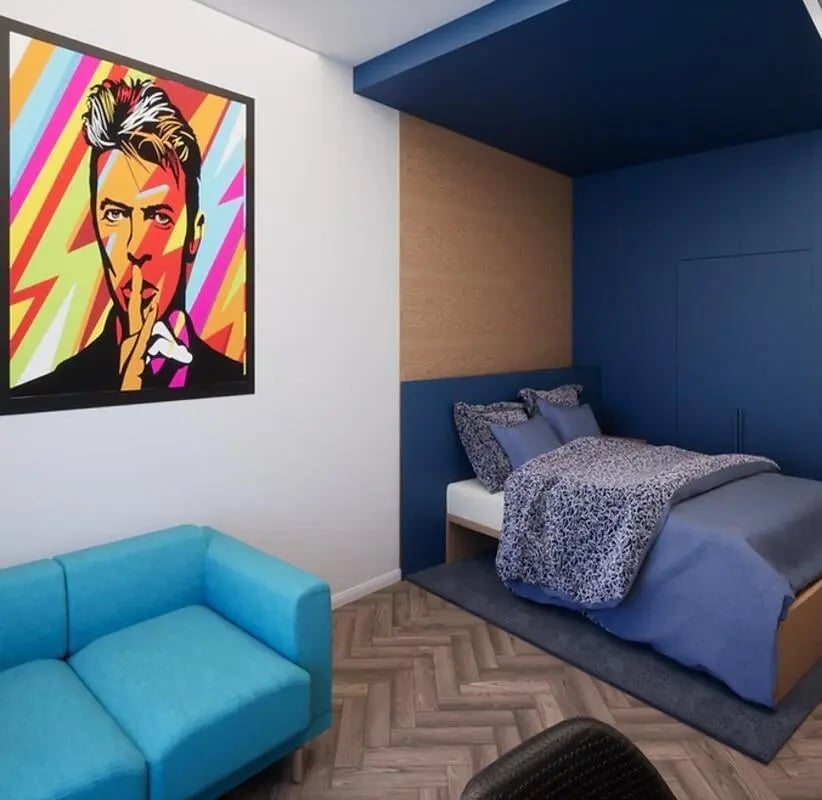 Artwork and blue sofa in a bedroom at The Orchard in Leicester Student Accommodation