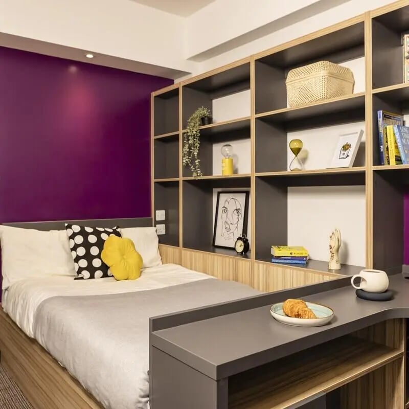 Bed desk and shelves bedroom at Peel Park Quarter in Salford Student Accommodation