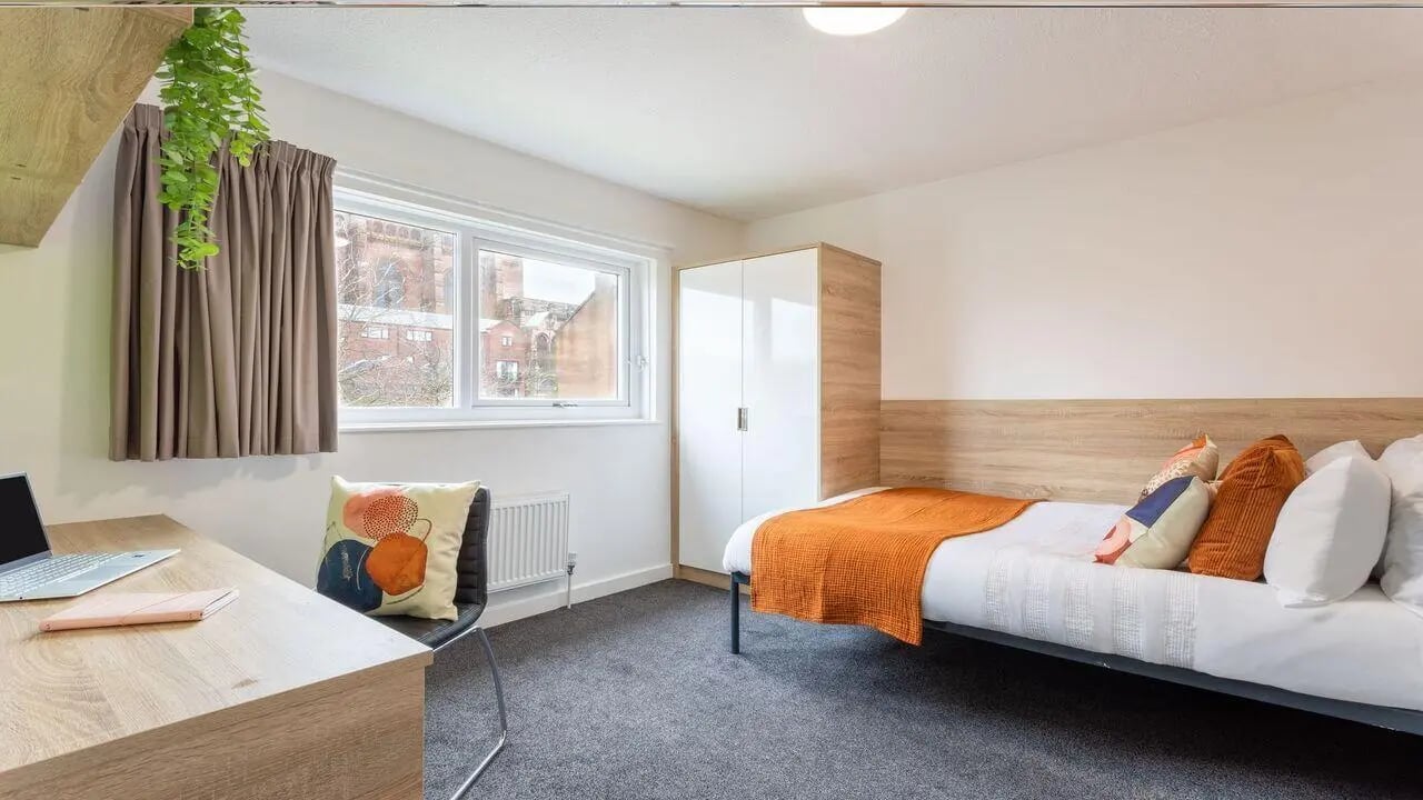 Desk bed wardrobe and chair bedroom at dwell Cathedral Campus in Liverpool Student Accommodation