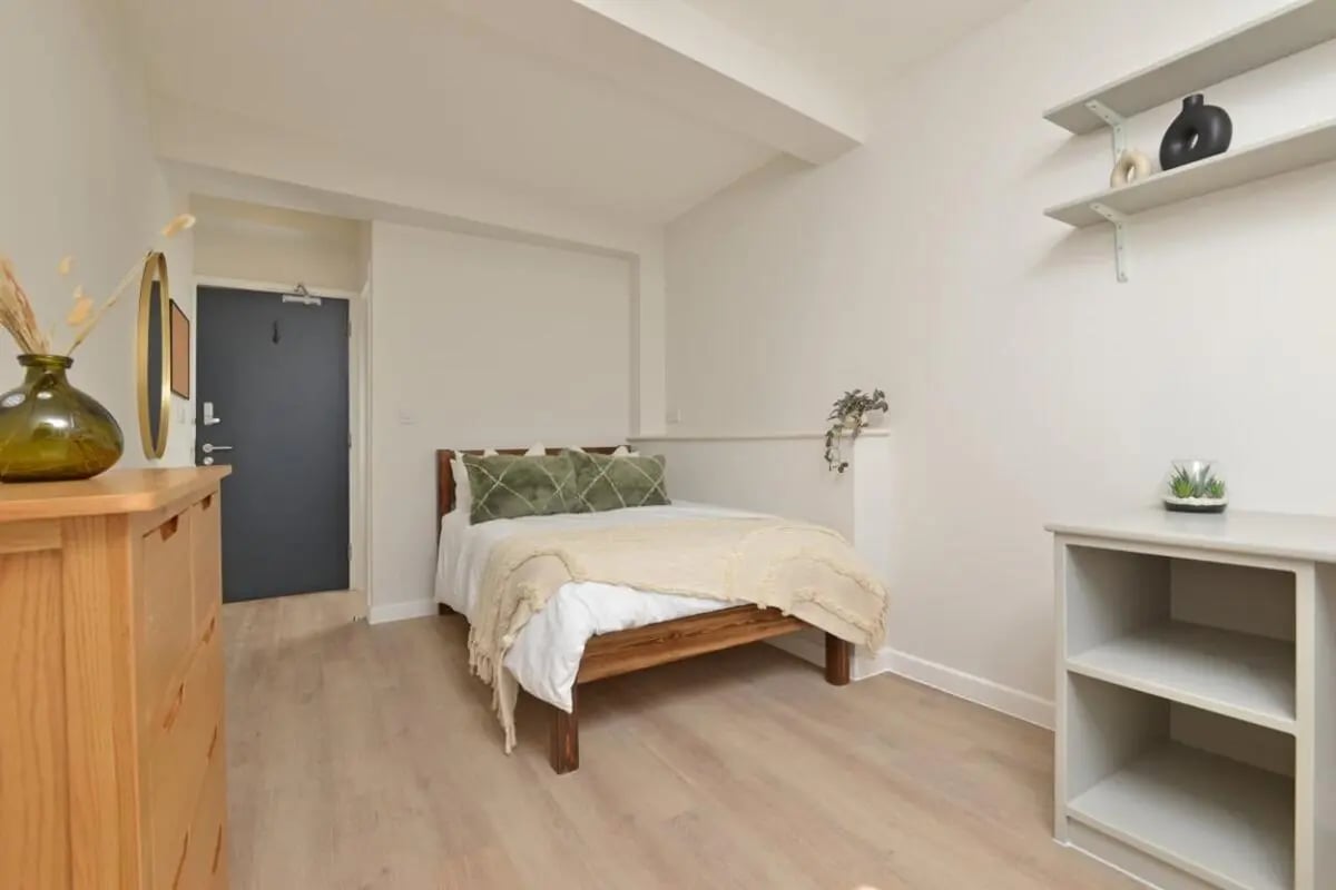 Bed dresser door shelves succulent bedroom at Isca Lofts in Exeter Student Accommodation