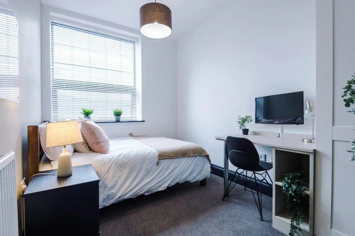 Bed desk chair television bedroom at The Hosiery in Leicester Student Accommodation