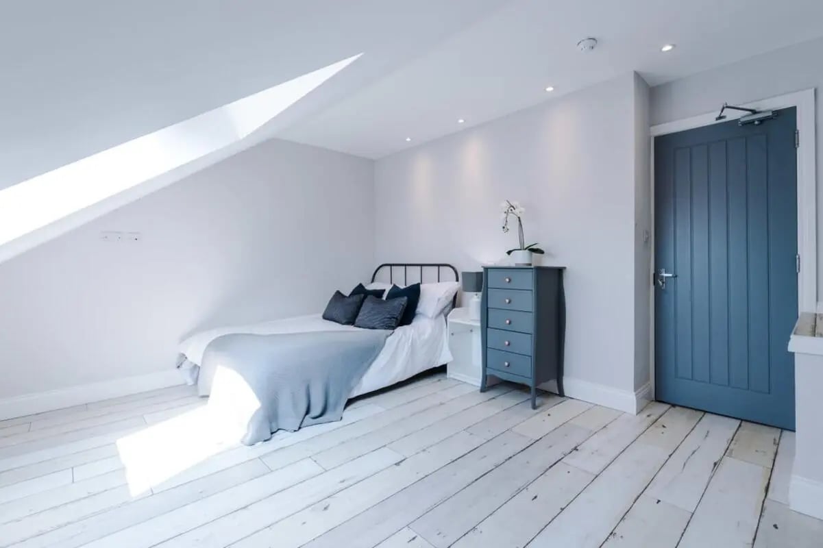 Bed dresser blue door bedroom at 86 Woodcroft Road in Liverpool Student Accommodation