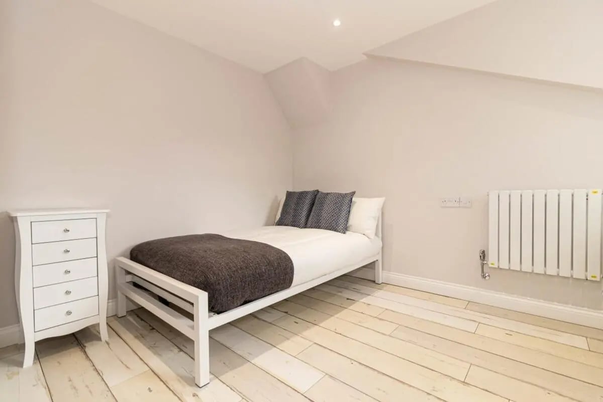 Bed dresser and radiator bedroom at 74 Woodcroft Road in Liverpool Student Accommodation