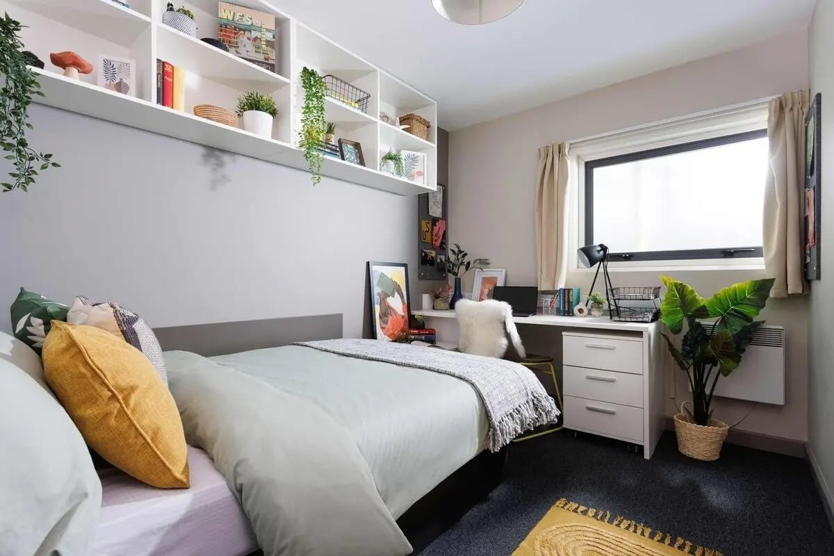 Bed desk plants and shelves bedroom at Exchange Works in Sheffield Student Accommodation