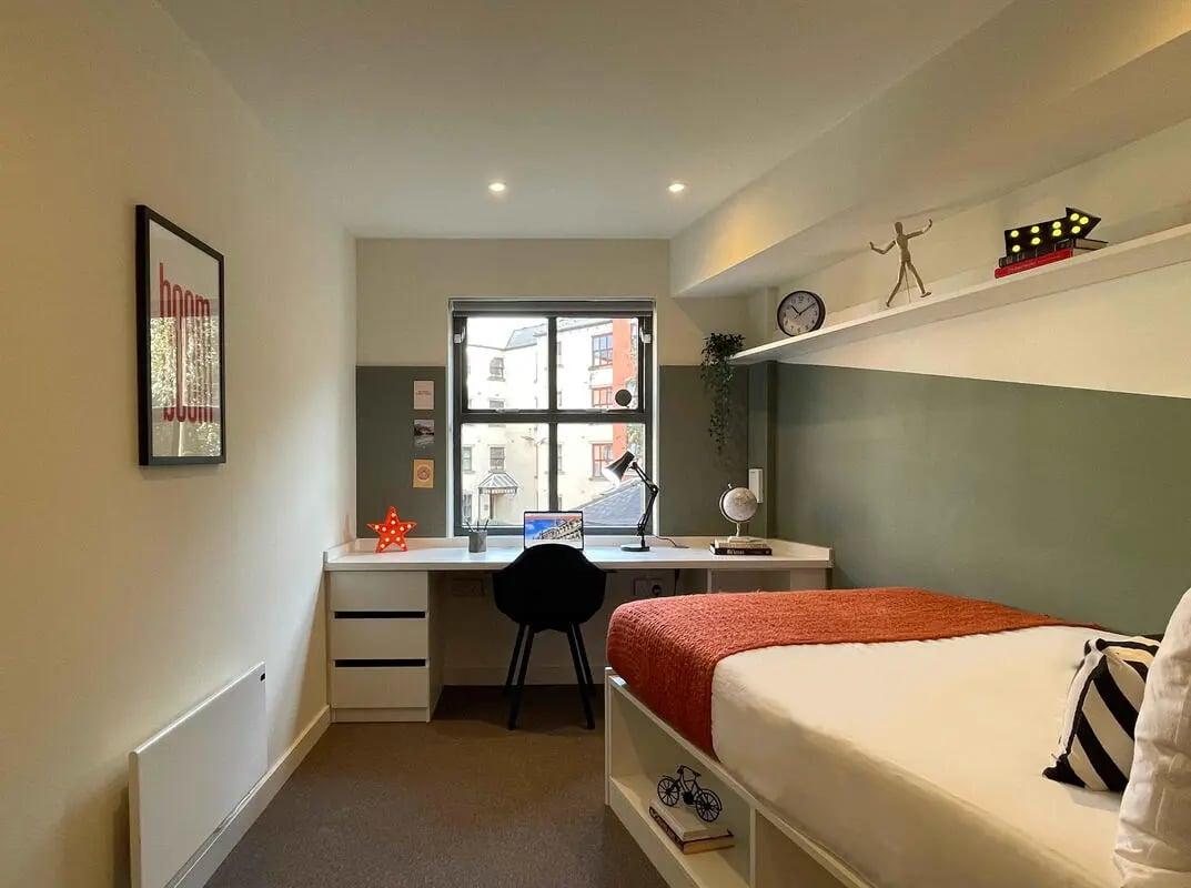 Bed desk and poster student accommodation bedroom at Firth Point in Huddersfield Student Accommodation