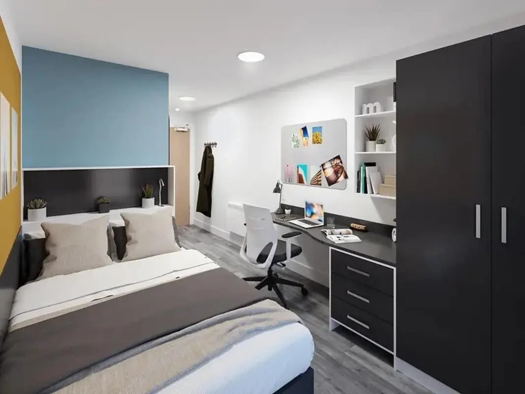Bed desk whiteboard wardrobe bedroom at Depot Point in London Student Accommodation