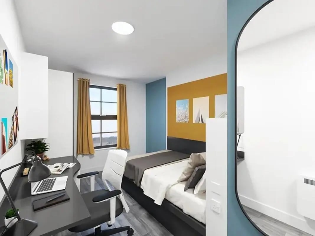 Bed desk chair window paintings bedroom at Depot Point in London Student Accommodation