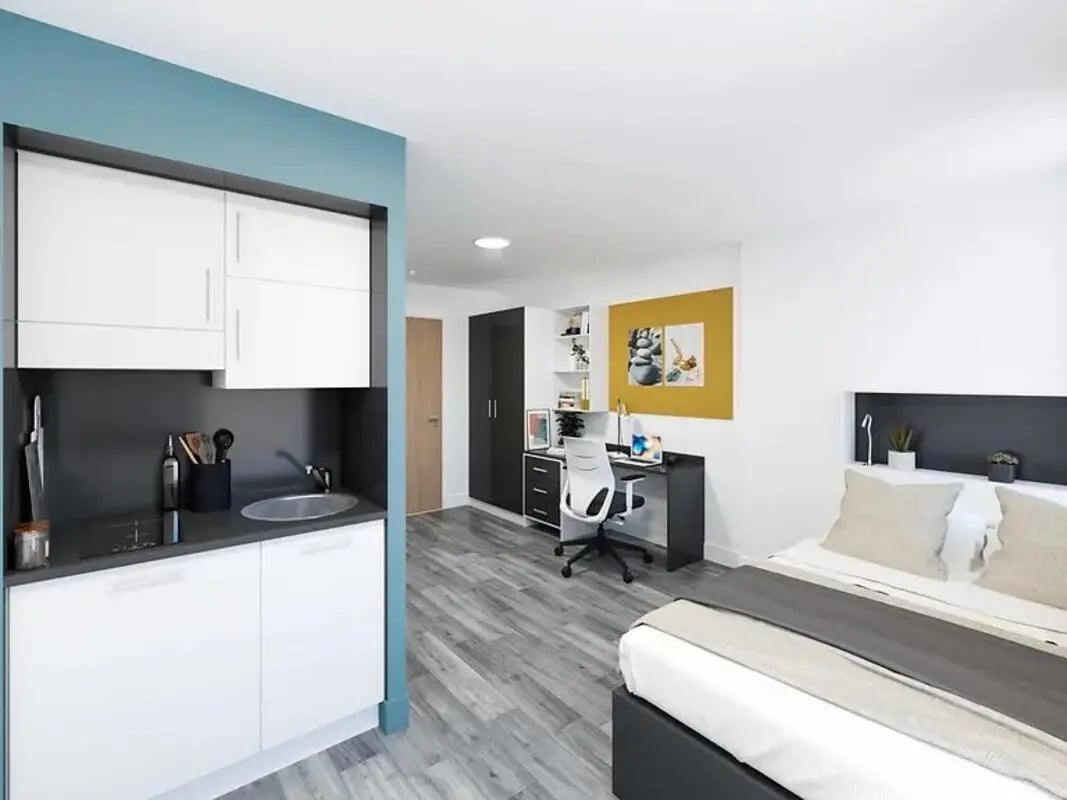 Compact kitchen desk chair and bed living room at Depot Point in London Student Accommodation