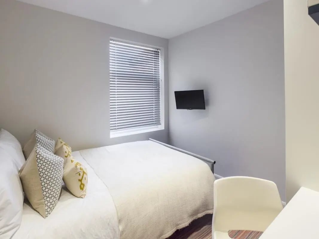 Bed pillows television and chair bedroom at 6 Guildford Street in Stoke-On-Trent Student Accommodation