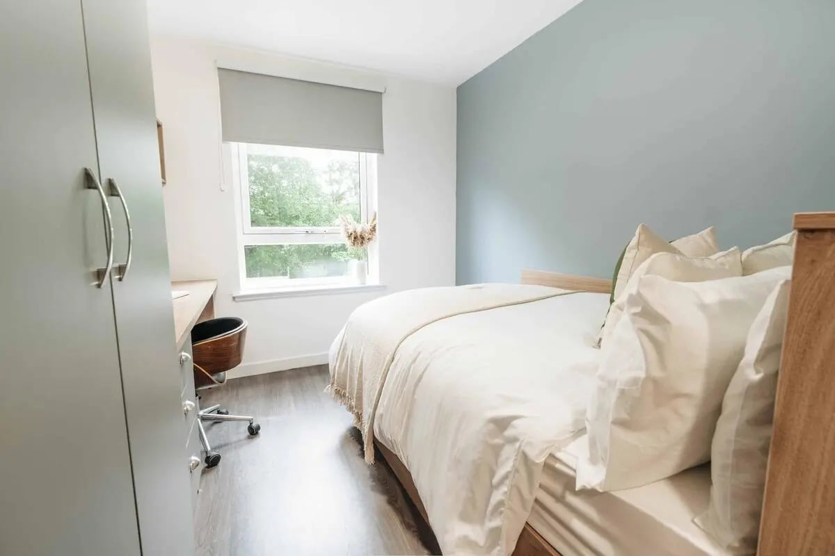Wardrobe desk chair and bed bedroom at Caledon Court in Aberdeen Student Accommodation
