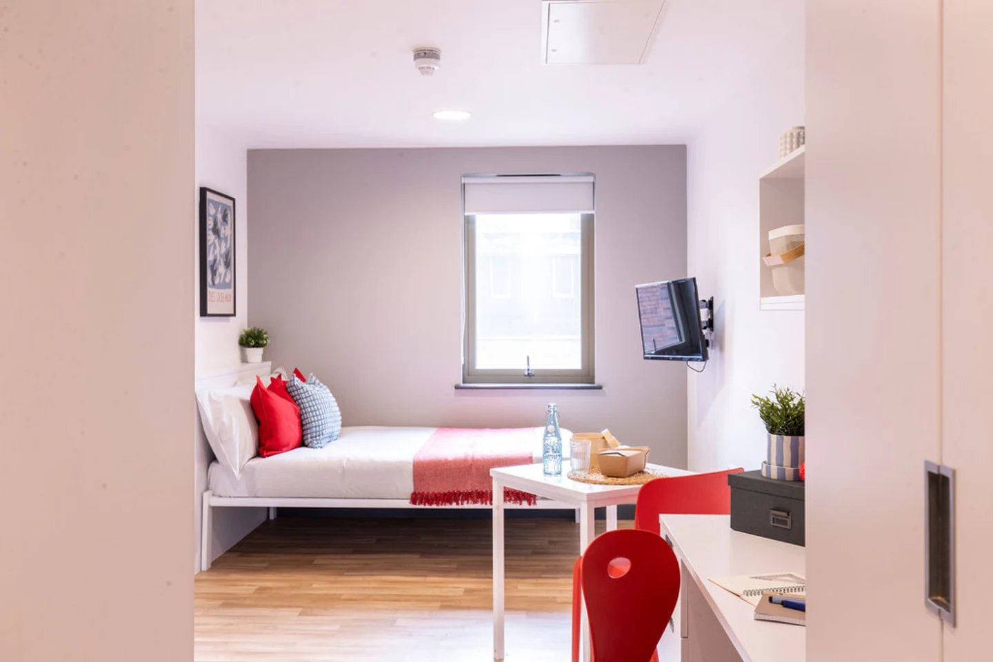 Bed table TV and chairs student room at Bailey Street in Sheffield Student Accommodation