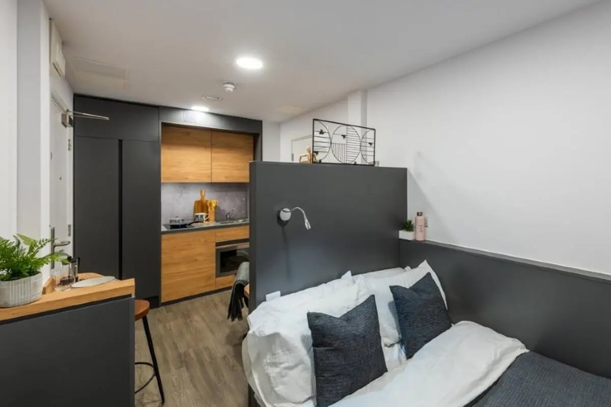 Bed with kitchen and storage modern studio bedroom at The Valentine London in London Student Accommodation