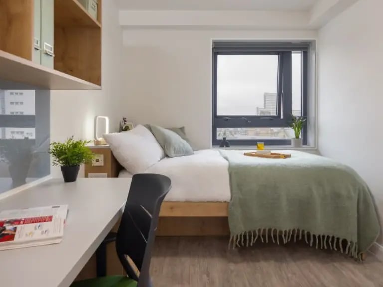 Bed desk plant and shelves student bedroom at Yugo Goldsmith Court in Nottingham Student Accommodation