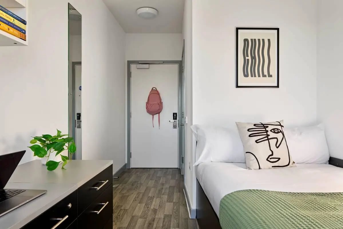 Bed desk mirror door backpack artwork bedroom at The Maltings in Colchester Student Accommodation