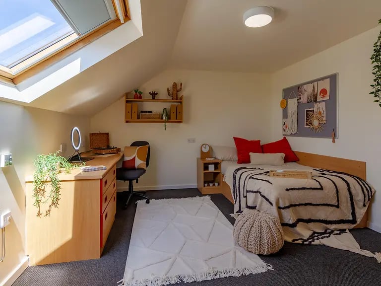 Desk bed rug bedside table bedroom at Yugo Park Court in Lincoln Student Accommodation