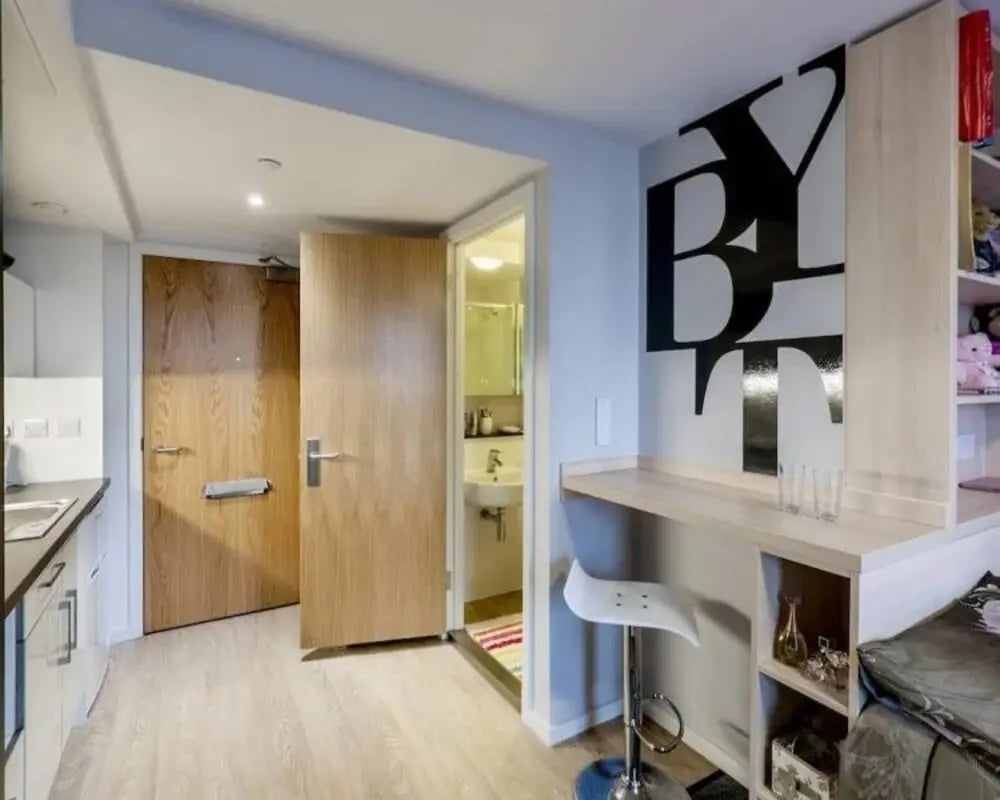 Kitchen area with doors and bathroom study area at The View - Newcastle in Newcastle Upon Tyne Student Accommodation