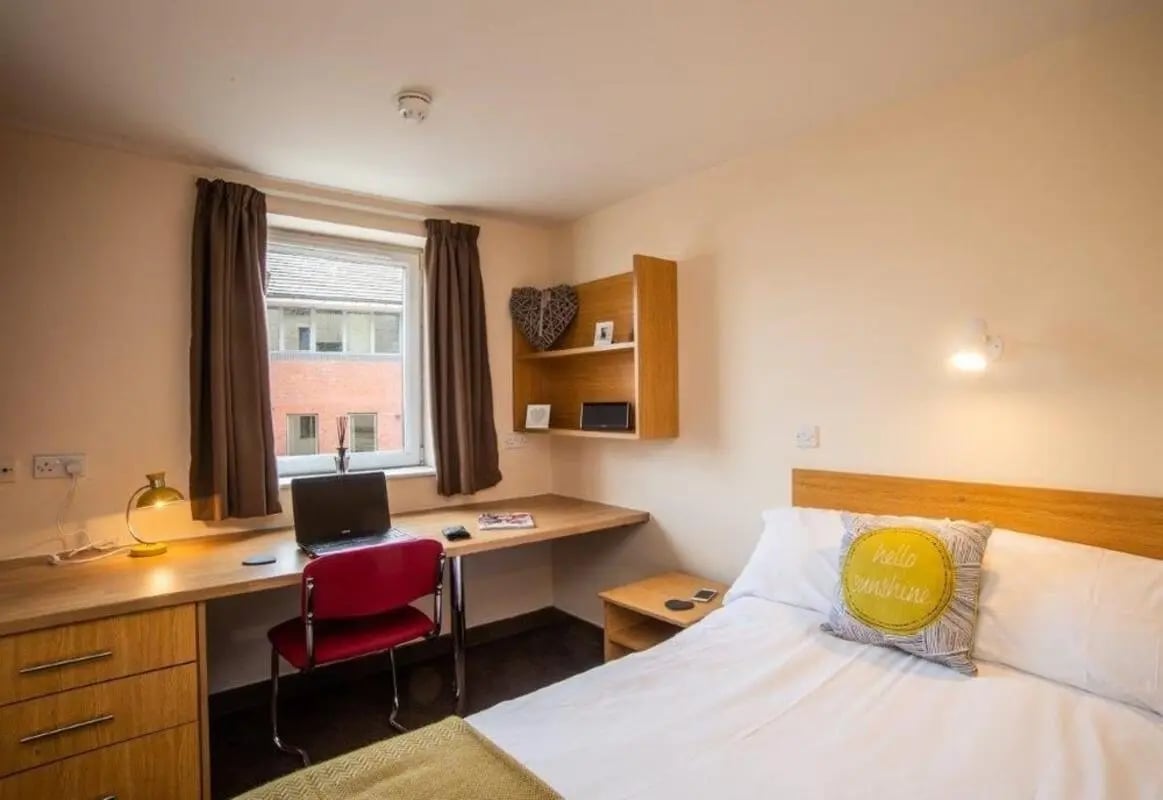 Desk bed lamp laptop chair shelves bedroom at Asha House in Loughborough Student Accommodation