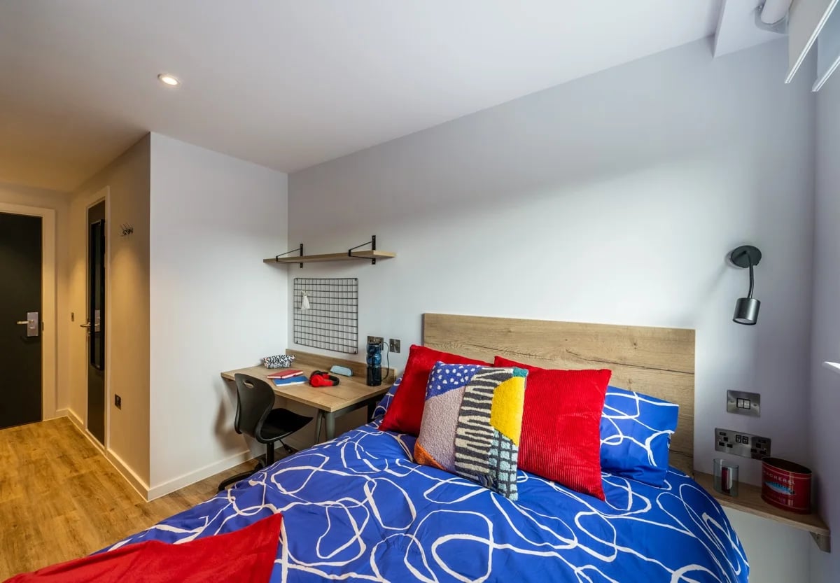 Bed desk chair pillows and bedding bedroom at Murieston Crescent - Edinburgh in Edinburgh Student Accommodation