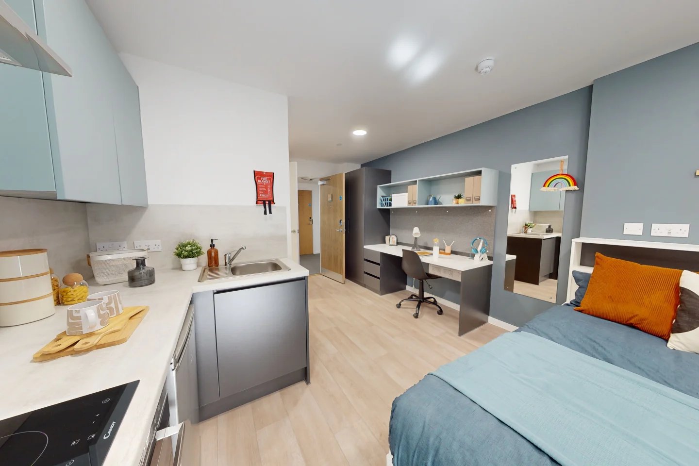 Bed desk sink and kitchen student accommodation studio at Enso in Colchester Student Accommodation