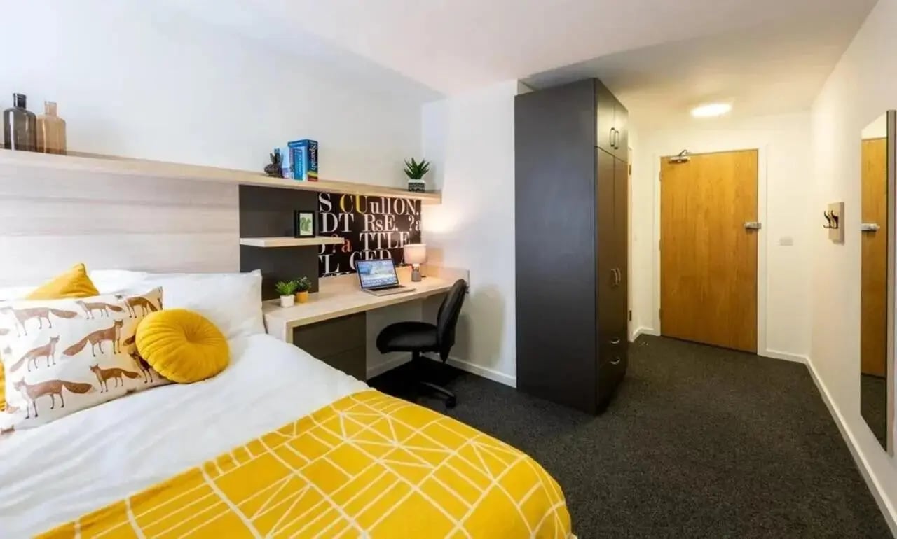 Bed desk laptop wardrobe and door Bedroom at The Arch - Liverpool in Liverpool Student Accommodation
