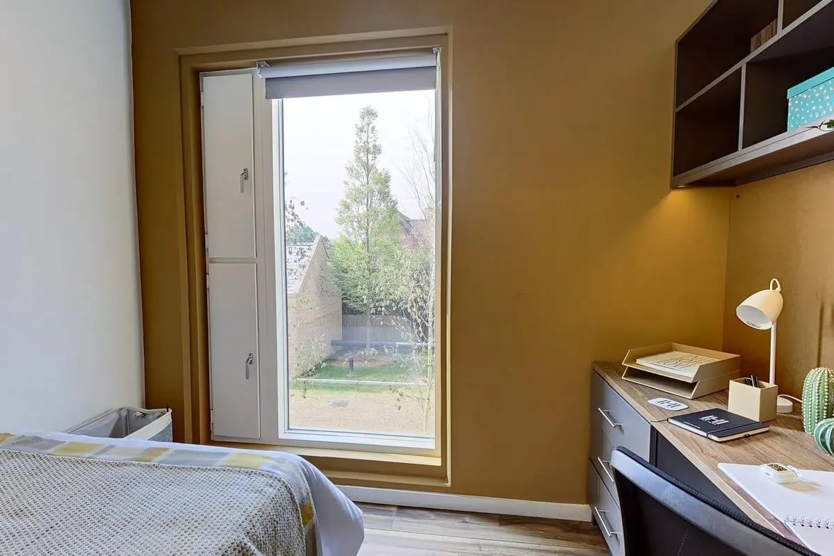 Bed desk and window view bedroom at Hox Park in Egham Student Accommodation