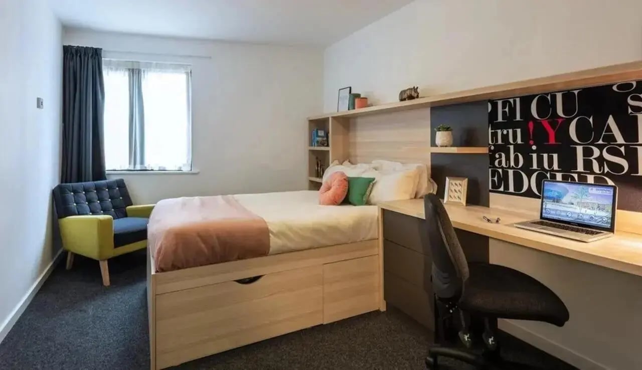 Bed chair desk laptop shelves bedroom study area at The Arch - Liverpool in Liverpool Student Accommodation