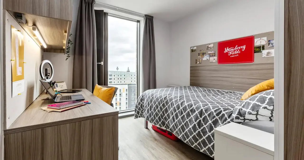 Desk bed and window in student bedroom at Kaplan Living Liverpool in Liverpool Student Accommodation
